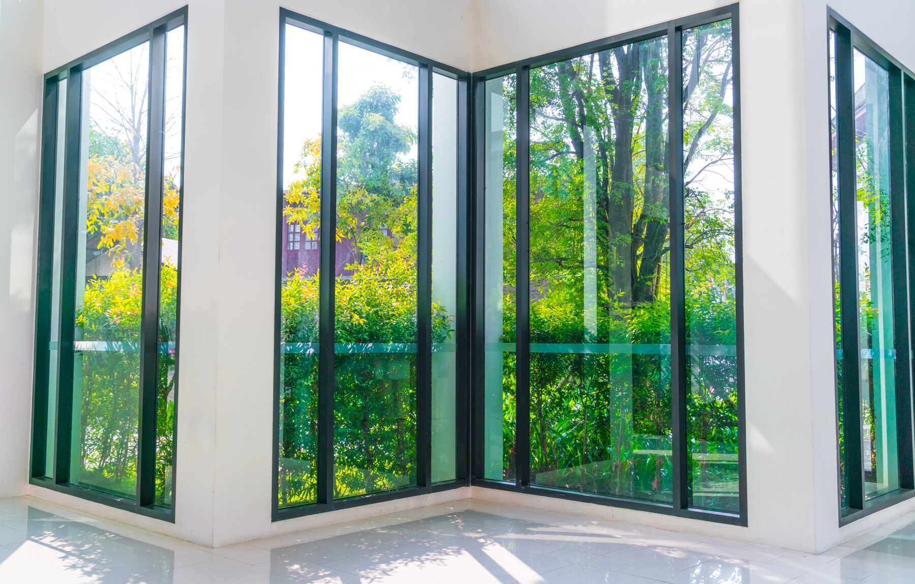 glass-window-overlooking-green-garden_1232-2979